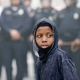 Baltimore Police officers in riot gear look toward protestors along Reisterstown Road near Mondawmin Mall, April 27, 2015, in Baltimore. (Drew Angerer/Getty Images)